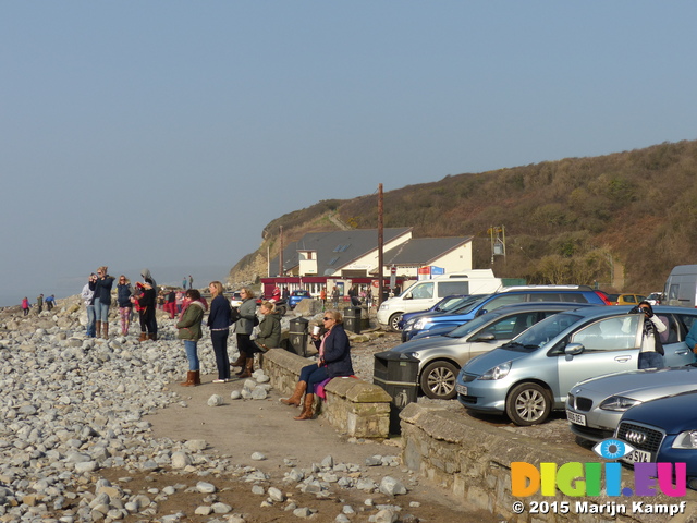 FZ012351 People watching partial solar eclips on Llantwit Major beach